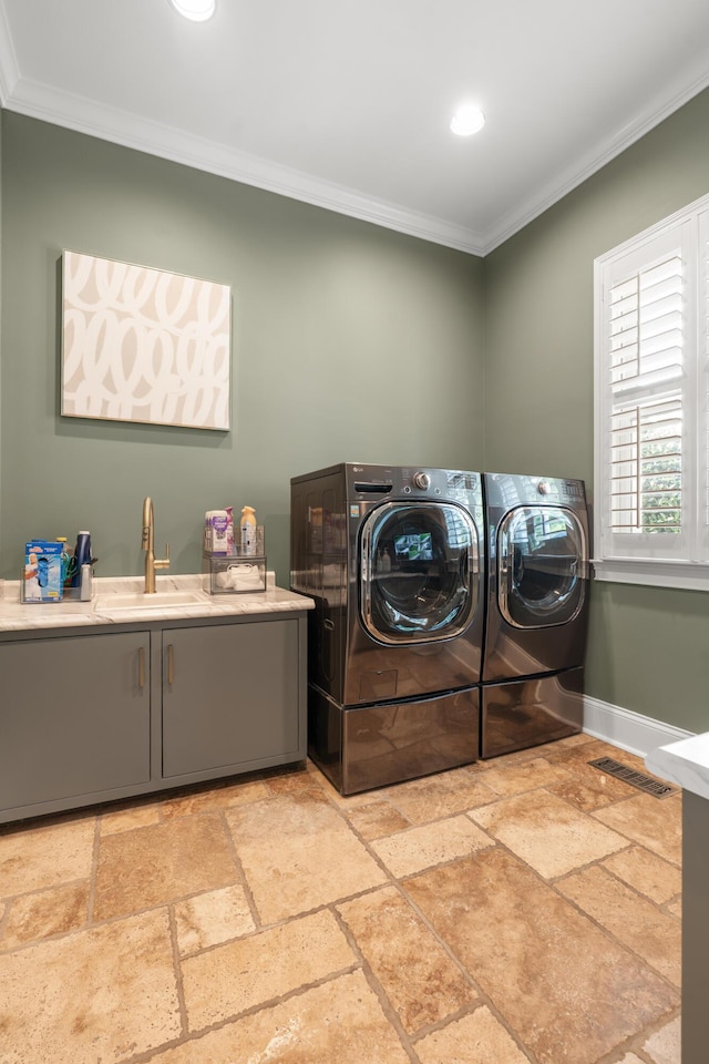 715 Pembridge Cir NW, Cleveland, TN 37312 - laundry area with cabinet space, ornamental molding, stone tile floors, washer and dryer, and recessed lighting