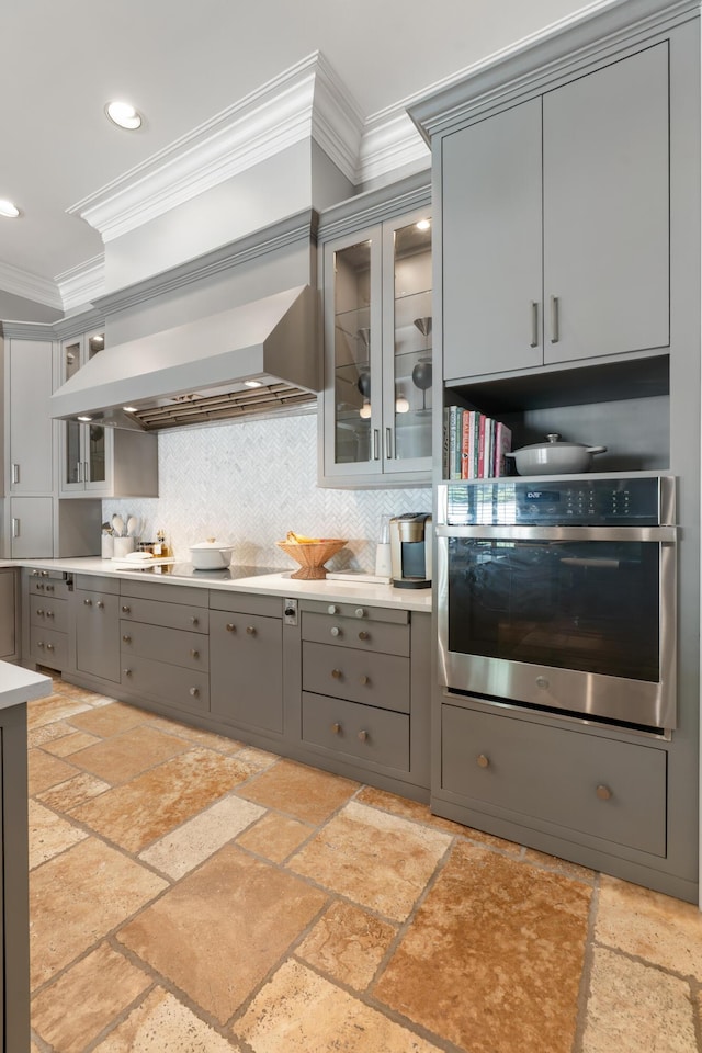 715 Pembridge Cir NW, Cleveland, TN 37312 - kitchen featuring gray cabinetry, oven, extractor fan, ornamental molding, and stovetop