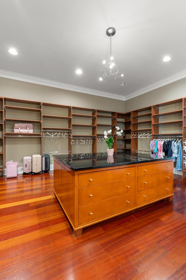 715 Pembridge Cir NW, Cleveland, TN 37312 - spacious closet with dark wood finished floors and a chandelier