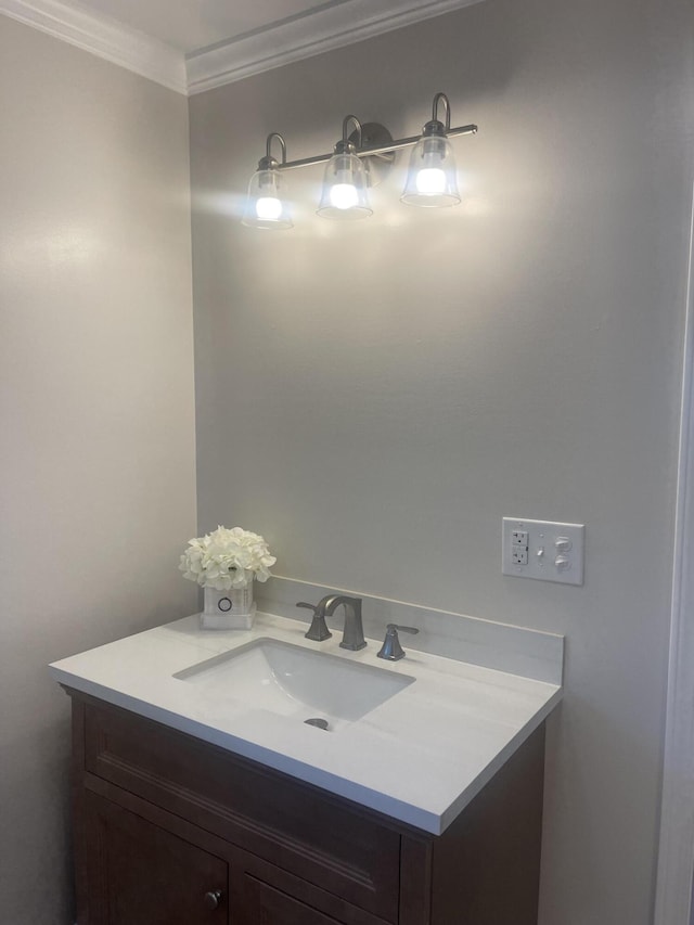 bathroom featuring vanity and crown molding