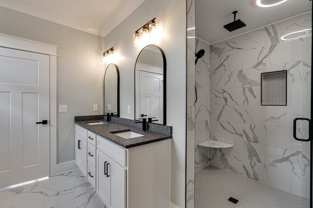 bathroom featuring a tile shower, vanity, and ornamental molding