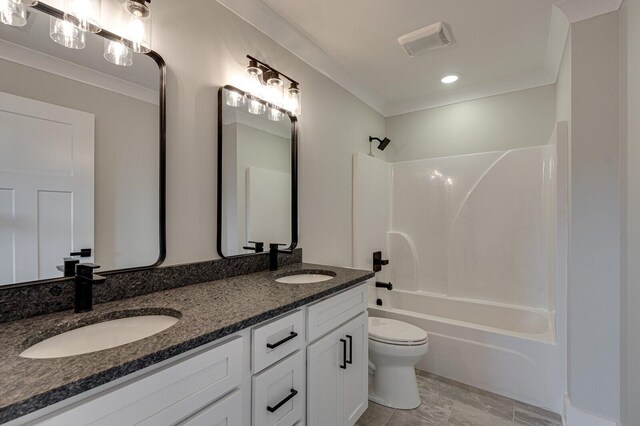 full bathroom with shower / washtub combination, vanity, ornamental molding, and toilet