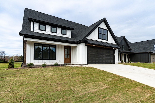 modern farmhouse style home with a front lawn and a garage