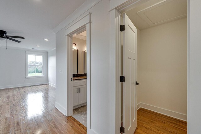 corridor with light hardwood / wood-style flooring