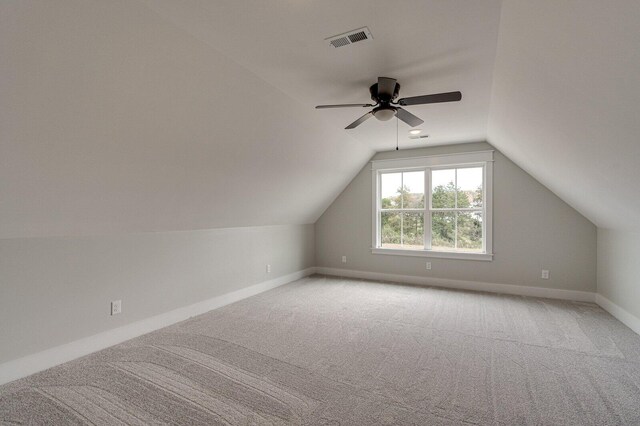 additional living space featuring carpet, ceiling fan, and lofted ceiling