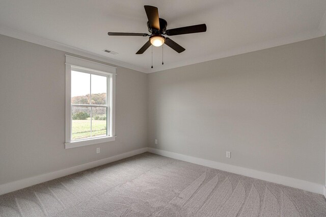 unfurnished room featuring carpet flooring, ceiling fan, and ornamental molding