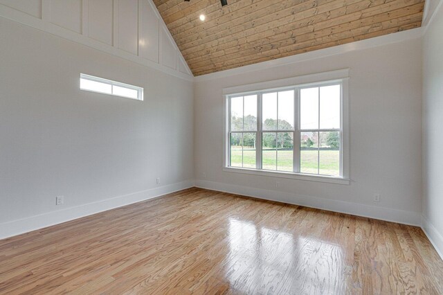 unfurnished room featuring high vaulted ceiling, wooden ceiling, and light hardwood / wood-style floors