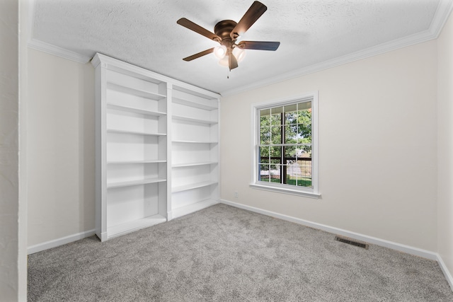 unfurnished bedroom featuring ceiling fan, crown molding, light carpet, and a textured ceiling