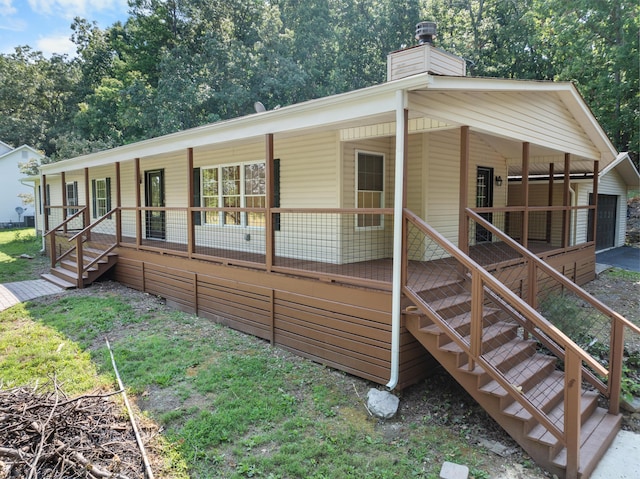 view of front facade with a porch and a garage