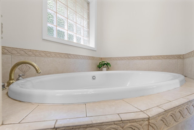 bathroom featuring tiled bath