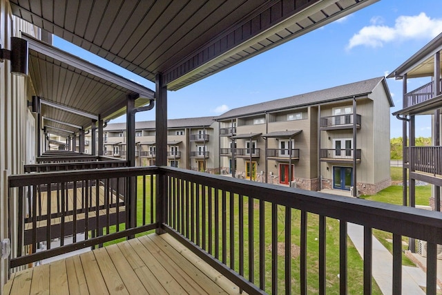 wooden terrace with a yard