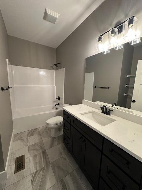 full bathroom with vanity, toilet, and shower / bath combination