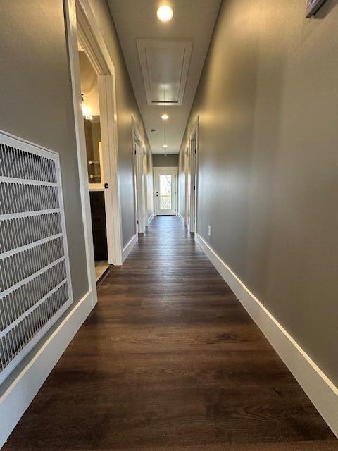 corridor featuring dark hardwood / wood-style floors