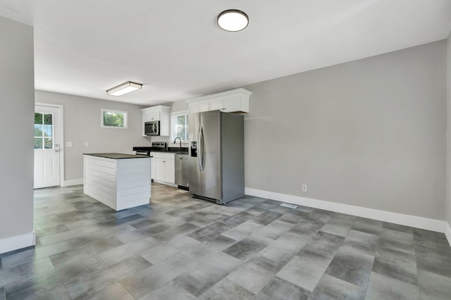 kitchen featuring white cabinets, sink, and stainless steel appliances