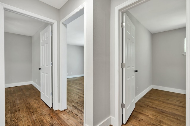 corridor featuring wood-type flooring