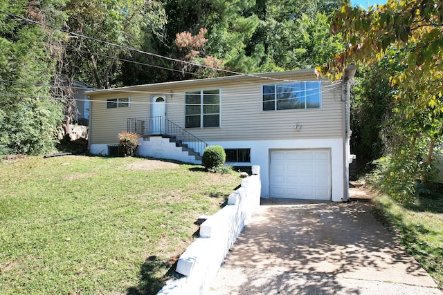 view of front facade featuring a garage and a front lawn