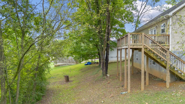 view of yard featuring a wooden deck