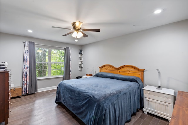 bedroom featuring dark hardwood / wood-style flooring and ceiling fan