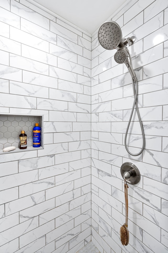 bathroom featuring tiled shower