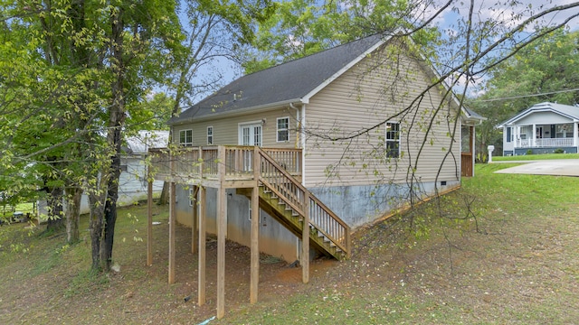 back of house featuring a wooden deck