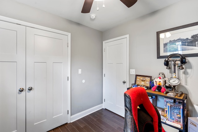 office with ceiling fan and dark wood-type flooring