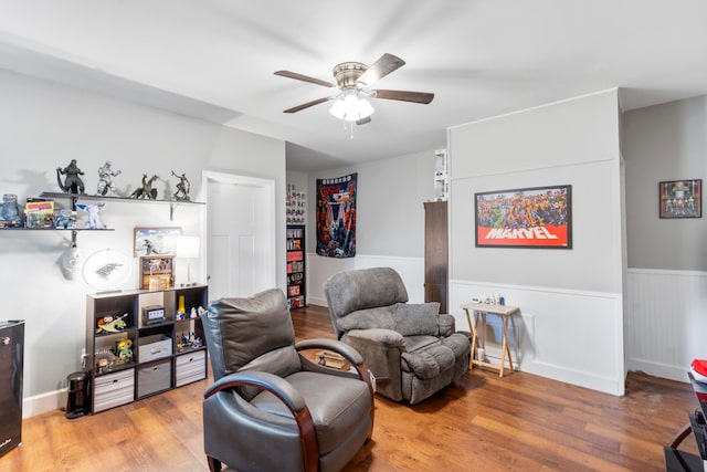 sitting room featuring ceiling fan and light hardwood / wood-style flooring