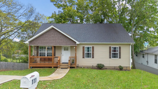 view of front facade with a porch and a front yard