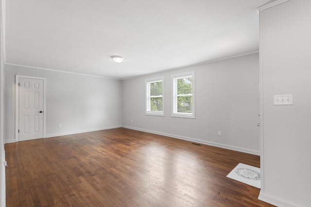 922 Barnabas St, Athens, TN 37303 - spare room featuring dark wood-style floors, ornamental molding, and baseboards