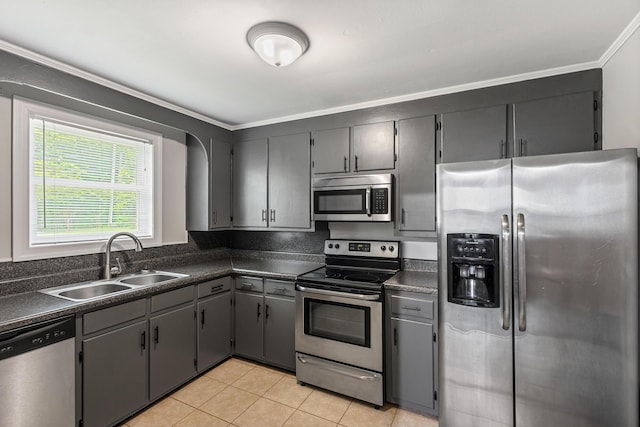 922 Barnabas St, Athens, TN 37303 - kitchen featuring appliances with stainless steel finishes, a sink, dark countertops, and ornamental molding