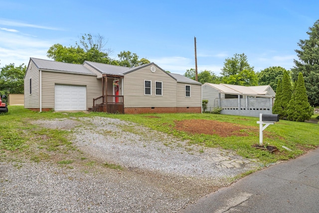 922 Barnabas St, Athens, TN 37303 - view of front facade featuring a garage, gravel driveway, crawl space, metal roof, and a front yard