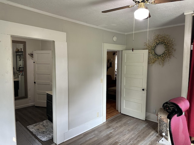 1785 Benton Station Rd, Benton, TN 37307 - bedroom with wood finished floors, a textured ceiling, ornamental molding, and ceiling fan
