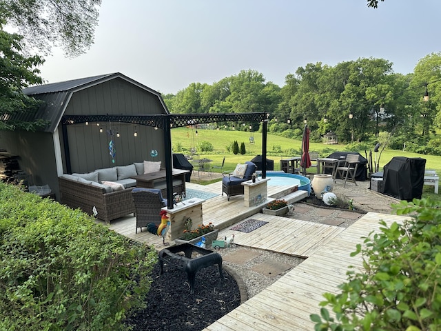 1785 Benton Station Rd, Benton, TN 37307 - deck featuring an outdoor living space, a grill, and an outbuilding