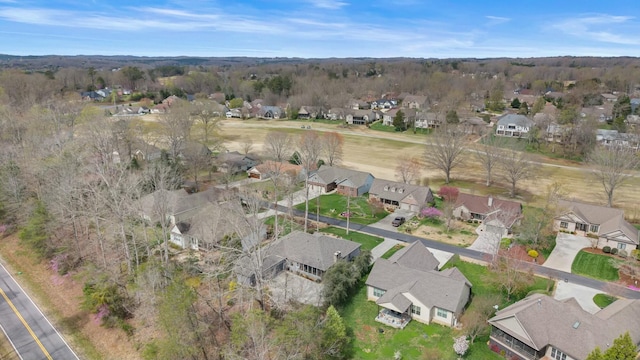 birds eye view of property with a residential view