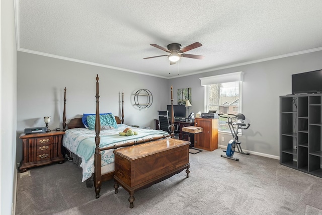 bedroom with carpet flooring, a textured ceiling, baseboards, ceiling fan, and ornamental molding
