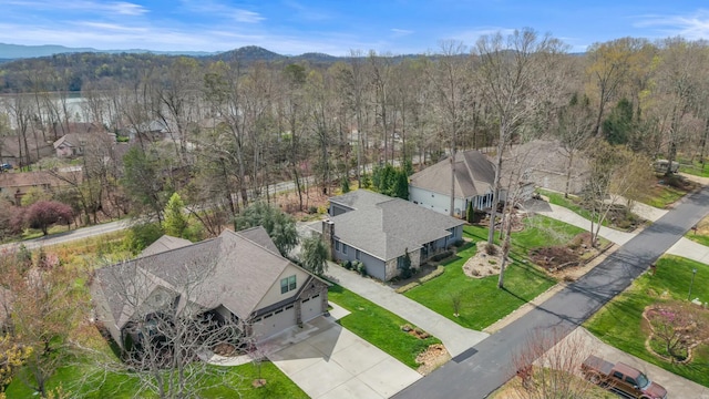 drone / aerial view featuring a view of trees