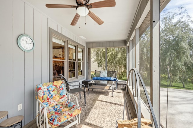 sunroom with a ceiling fan