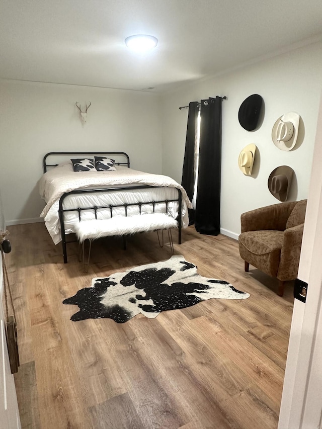 bedroom with light wood-type flooring