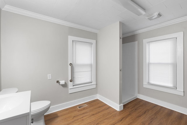 bathroom featuring a shower, wood-type flooring, toilet, and vanity