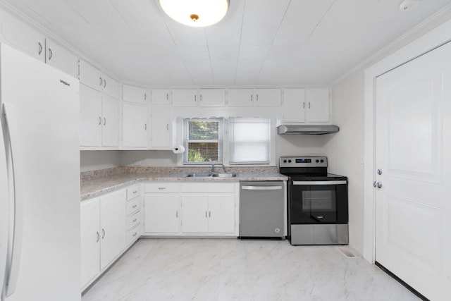 kitchen featuring white cabinets, appliances with stainless steel finishes, ornamental molding, and sink