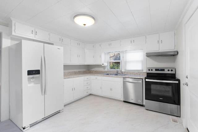 kitchen featuring sink, stainless steel appliances, and white cabinetry