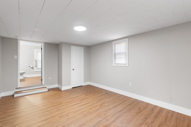 basement featuring light hardwood / wood-style floors