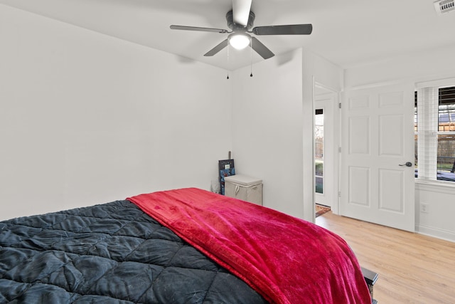 bedroom with light wood-type flooring and ceiling fan