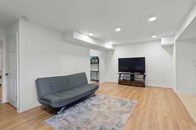 living room with light hardwood / wood-style flooring