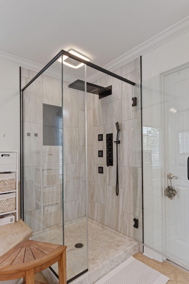 bathroom featuring an enclosed shower, crown molding, and tile patterned floors