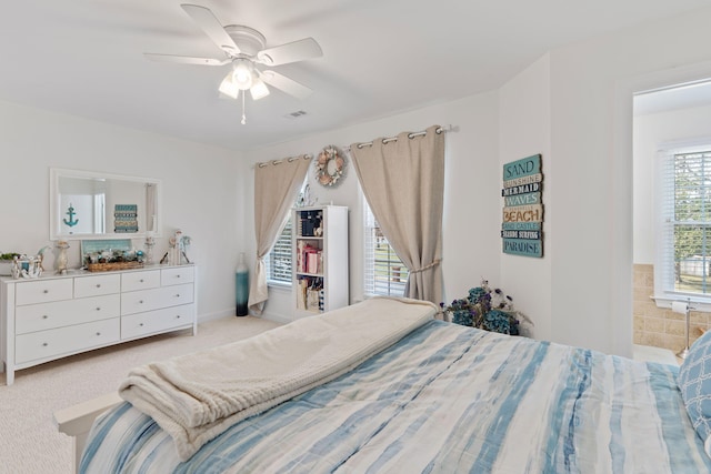 bedroom featuring light colored carpet and ceiling fan