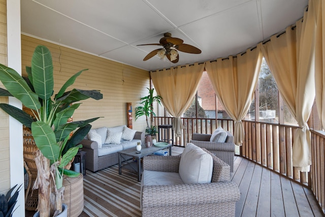 deck featuring an outdoor living space and ceiling fan