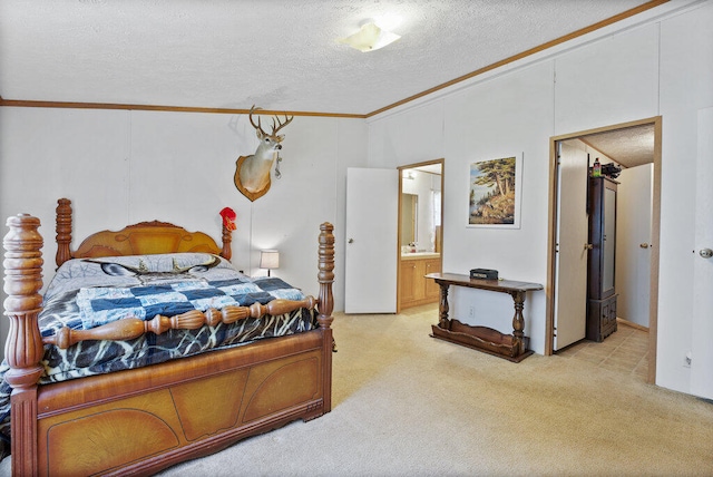 bedroom with light carpet, a textured ceiling, connected bathroom, and crown molding