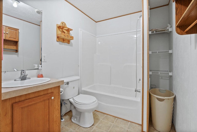 full bathroom with vanity, a textured ceiling, toilet, and shower / bathtub combination