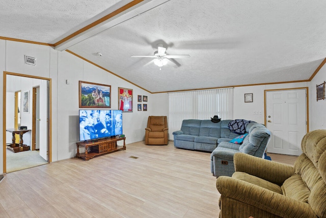 living room featuring vaulted ceiling with beams, ceiling fan, ornamental molding, a textured ceiling, and light hardwood / wood-style floors