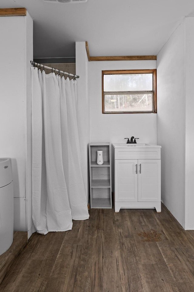 bathroom featuring sink and hardwood / wood-style flooring